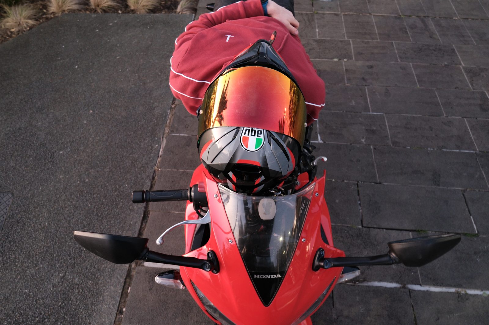 Clarissa's photography work — overhead shot of a rider on a red Honda CBR