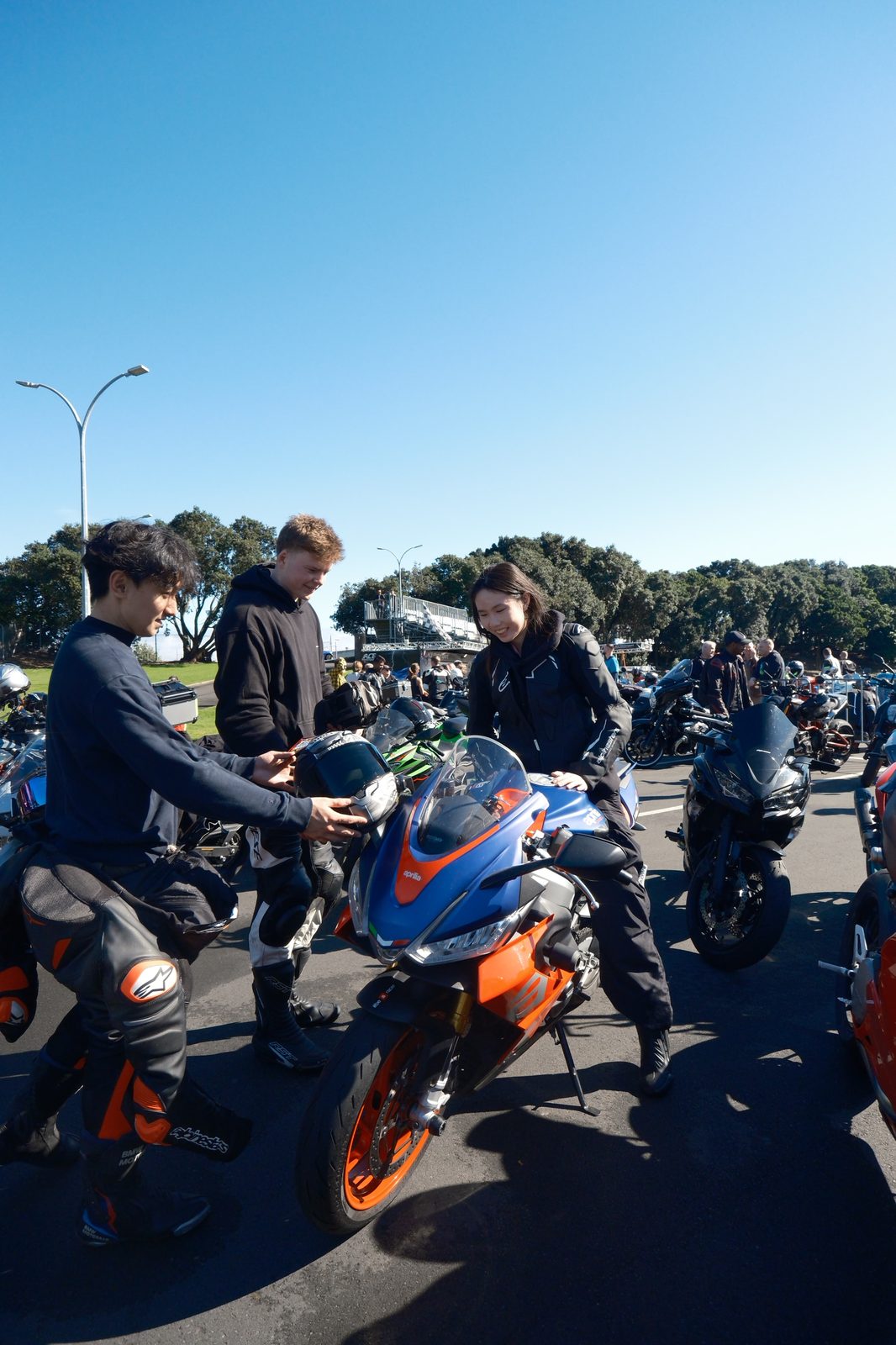 Clarissa and nd1ka06 talking with riders at a meet