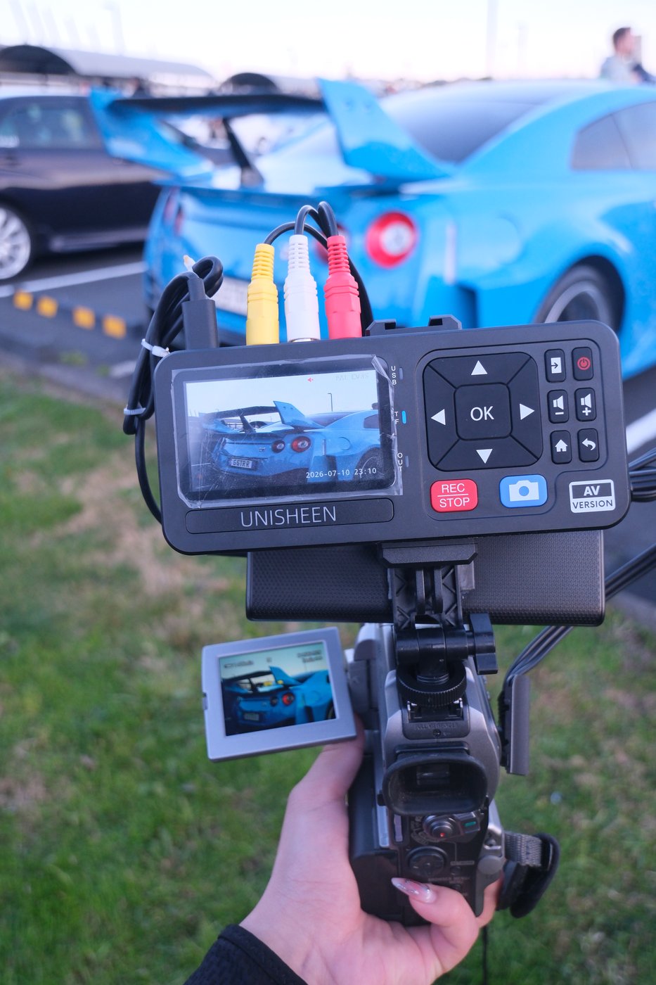 Tapeless camcorder build in use at a car meet, with a UNISHEEN converter attached